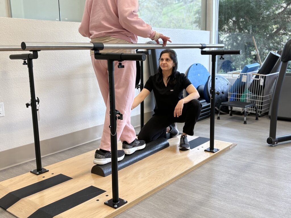 Thousand Oaks physical therapist guiding patient through balance training.